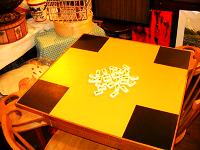An example of a finished domino or game table with blackboard paint in the corners for score keeping.
